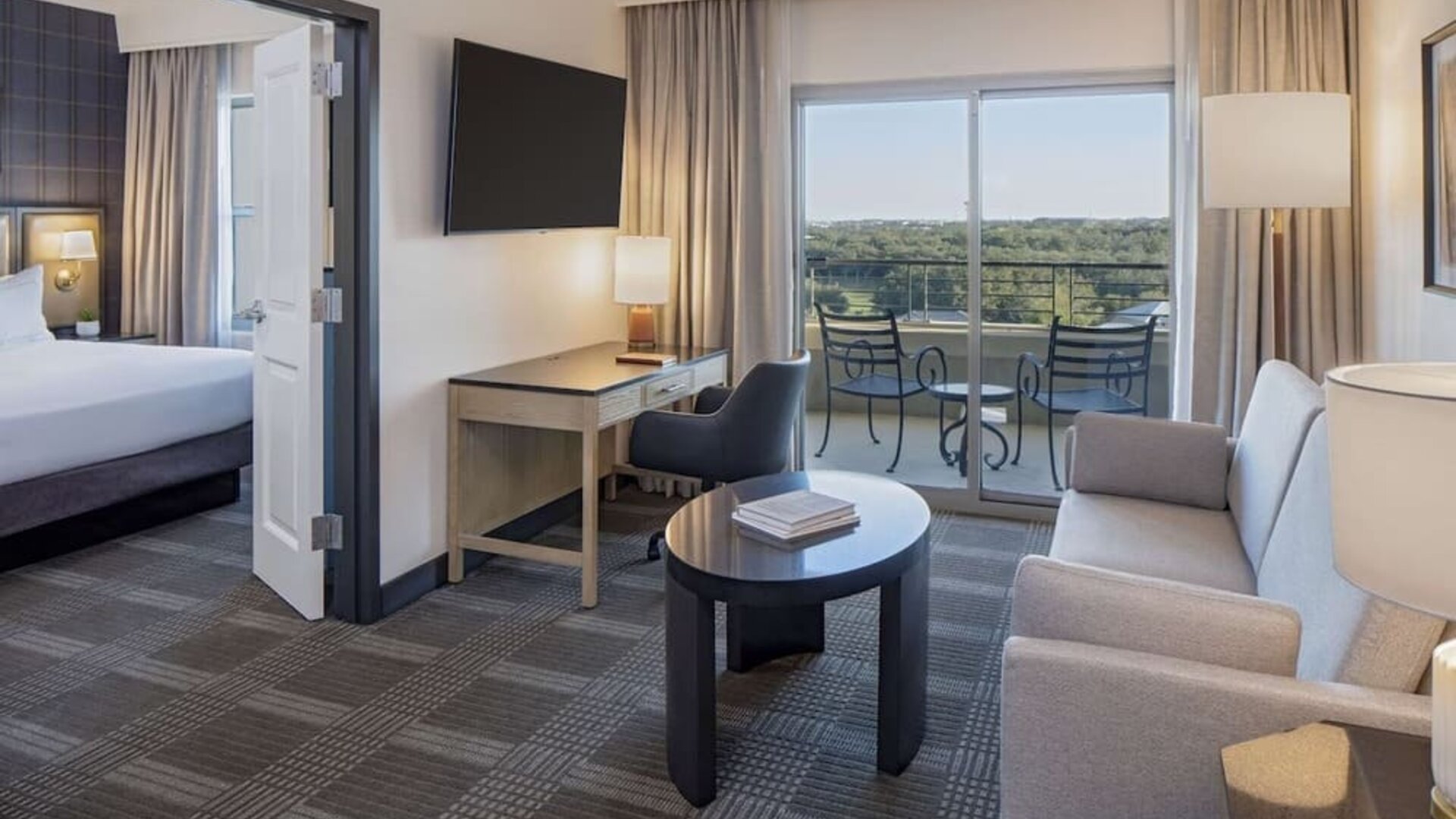 Day use room with living area and balcony at Hilton San Antonio Hill Country.
