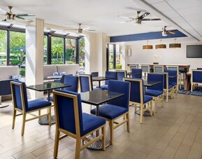 Dining and coworking space at Hampton Inn Ft. Lauderdale-Cypress Creek.