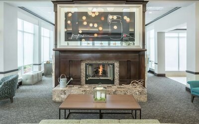 Lobby lounge area with fireplace at Hilton Garden Inn Dothan.