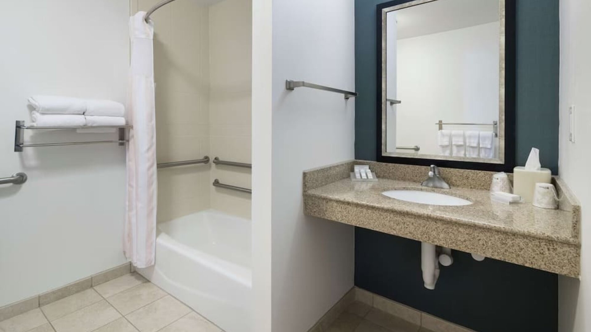 Private guest bathroom with combined shower and tub at Hilton Garden Inn Dothan.