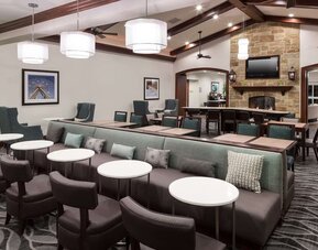 Dining area at Homewood Suites By Hilton Denton.