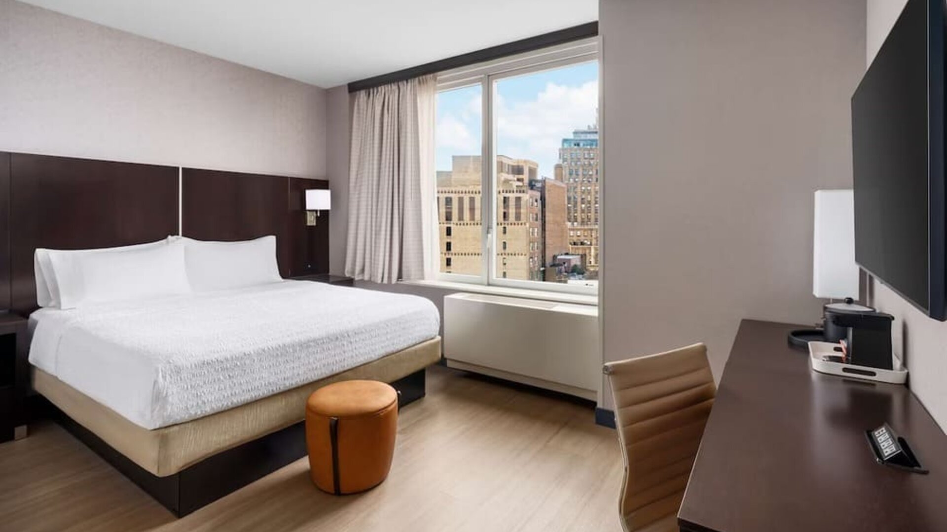 Bright and spacious day use room with work desk at Hampton Inn Manhattan/Times Square Central.
