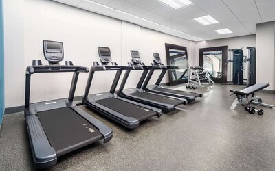 Fully equipped fitness center at Hampton Inn Manhattan/Times Square Central.