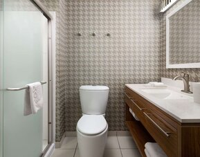 Private guest bathroom with shower and free toiletries at Home2 Suites By Hilton Charleston Airport/Convention Center.