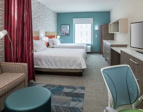 Day use twin room with work desk and lounge area at Home2 Suites By Hilton Cape Canaveral Cruise Port.