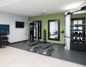 Fully equipped fitness center at Home2 Suites By Hilton Cape Canaveral Cruise Port.