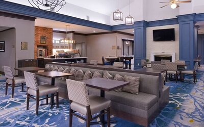 Dining area with comfortable seating, perfect for coworking at Homewood Suites By Hilton Dallas-Lewisville.