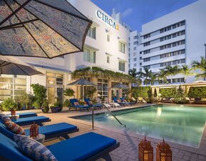 Outdoor pool with lounge seating at Circa 39 Hotel.