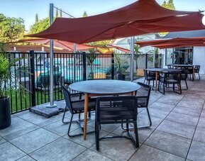 Hotel terrace with lounge seating at Hampton Inn Vallejo.