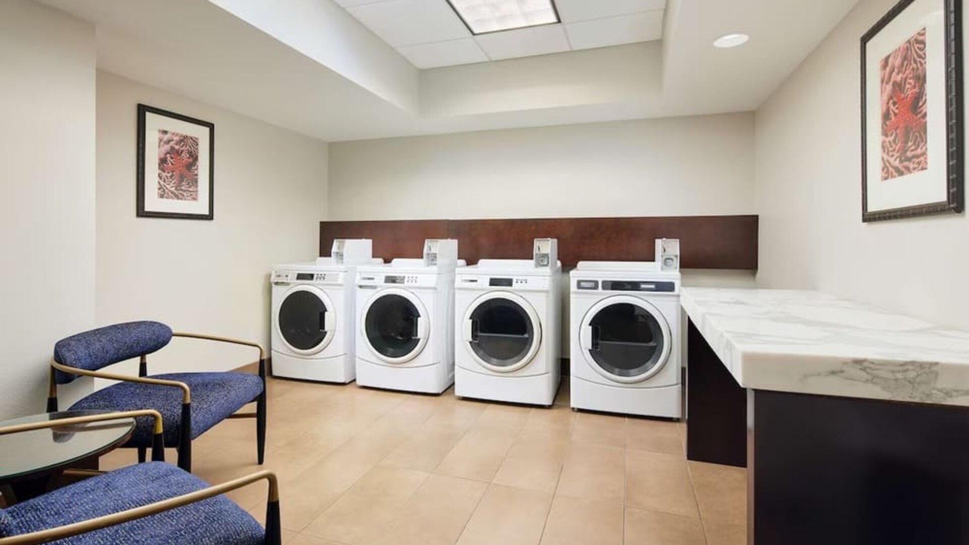 Laundry room available for guests at Embassy Suites By Hilton West Palm Beach Central.