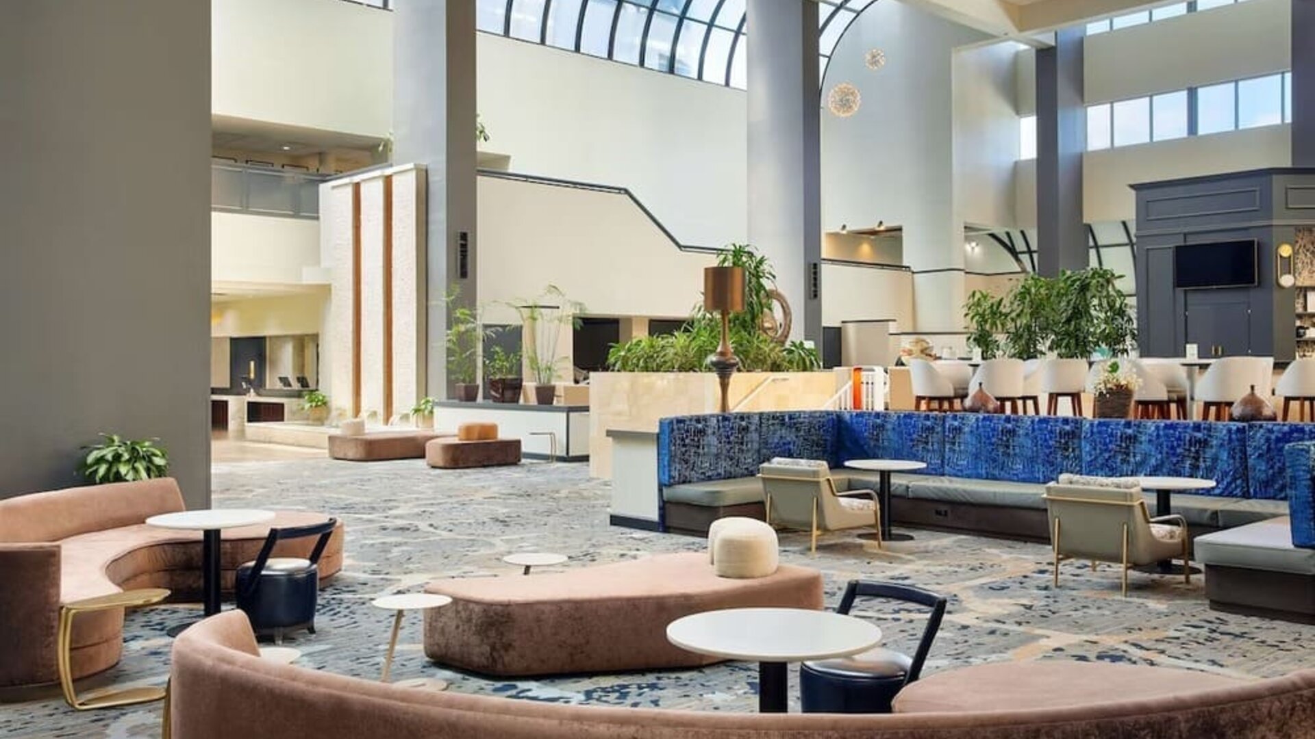 Lobby lounge area at Embassy Suites By Hilton West Palm Beach Central.