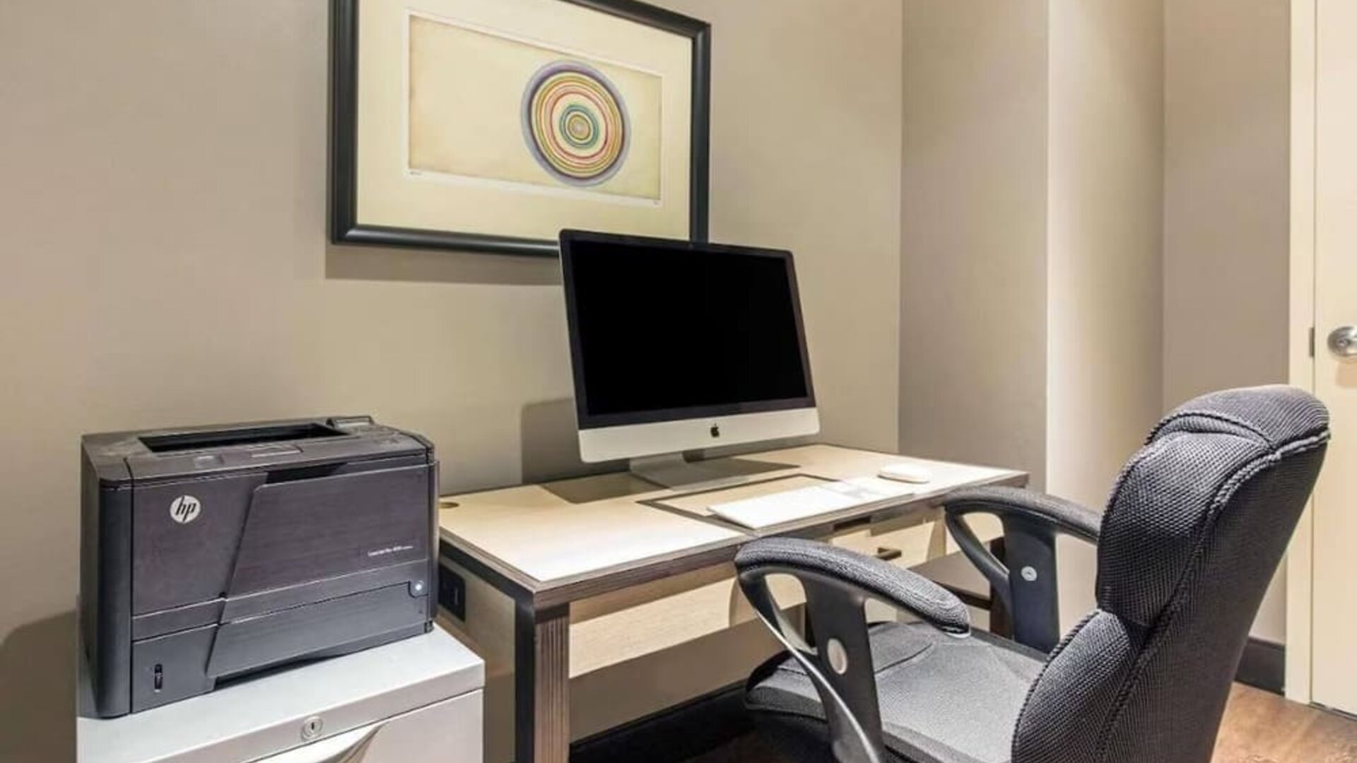 Business center with computer, printer and ergonomic chair at The Chicago Hotel Collection - Magnificent Mile.