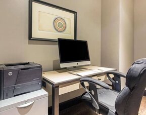 Business center with computer, printer and ergonomic chair at The Chicago Hotel Collection - Magnificent Mile.