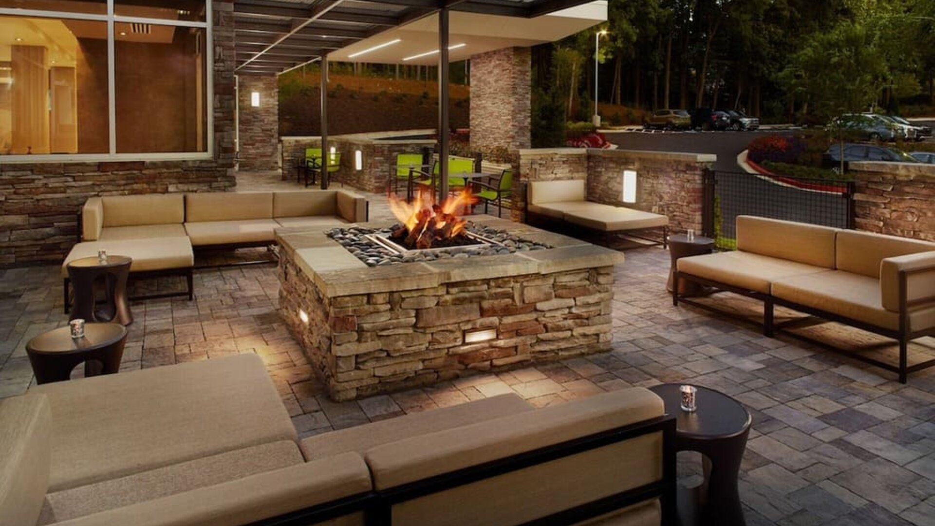 Patio with lounge seating and fire pit at 	SpringHill Suites Atlanta Northwest.