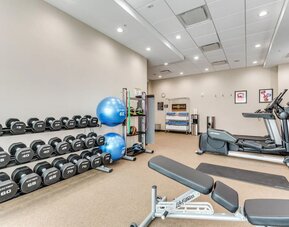 Well equipped fitness center at Home2 Suites By Hilton Dallas Medical District Lovefield.