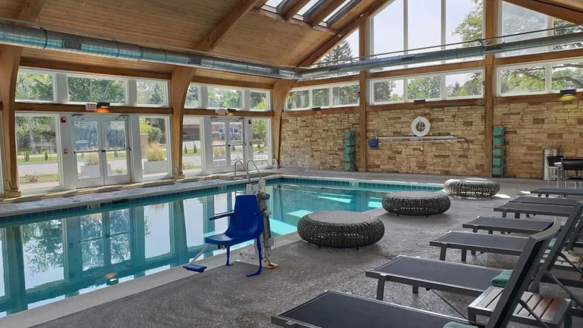 Pool loungers and indoor pool at Crowne Plaza Chicago SW.
