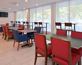 Dining area with comfortable seating at Holiday Inn Express Towson Baltimore North.