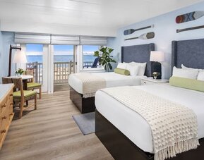 Day use twin room with workspace and balcony at Sea Crest Beach Hotel.