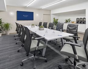 Professional meeting room with ergonomic chairs at Sea Crest Beach Hotel.