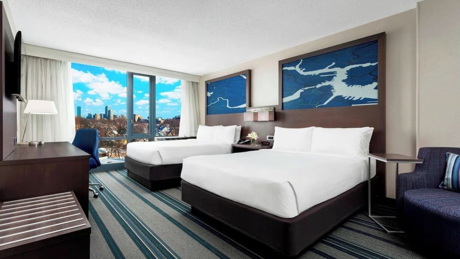 Day use twin room with work desk and living area at Courtyard Boston Cambridge.