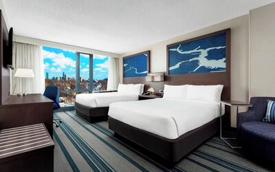 Day use twin room with work desk and living area at Courtyard Boston Cambridge.