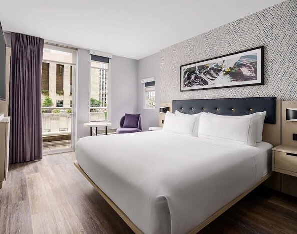 Day use room with workspace, floor to ceiling windows and private bathrooma at DoubleTree By Hilton New York Midtown Fifth Ave.