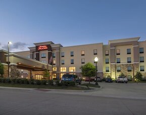 Hotel exterior and parking area at Hampton Inn & Suites Trophy Club - Fort Worth North, TX.
