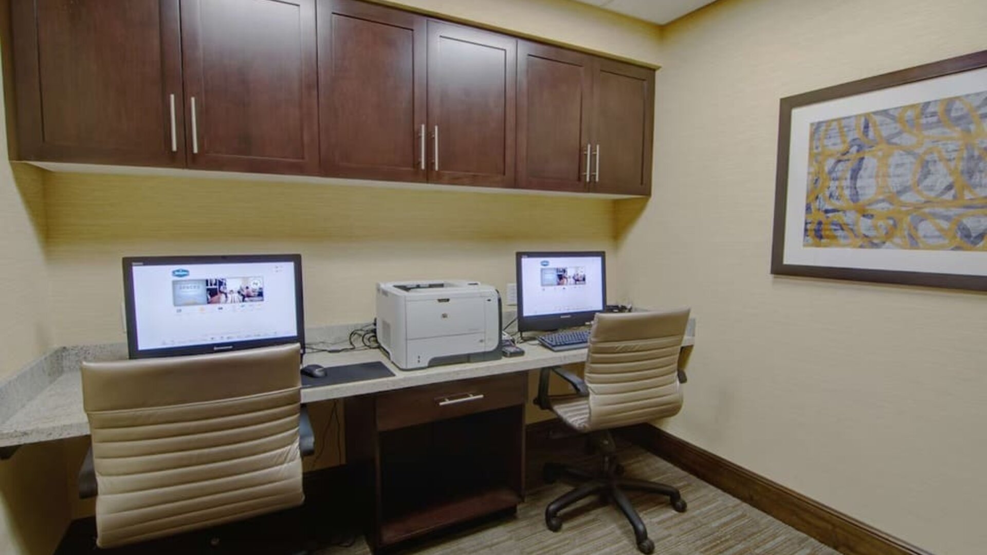 Business center with computers, printer and ergonomic chairs at Hampton Inn & Suites Trophy Club - Fort Worth North, TX.