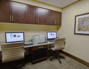 Business center with computers, printer and ergonomic chairs at Hampton Inn & Suites Trophy Club - Fort Worth North, TX.