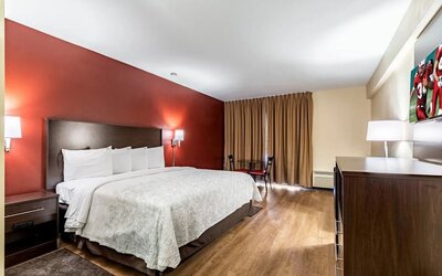 King room with workspace at Red Roof PLUS+ & Suites Houston - IAH Airport SW.