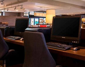 Business center with computers, printer and ergonomic chairs at Sonesta Select Atlanta Norcross I-85.
