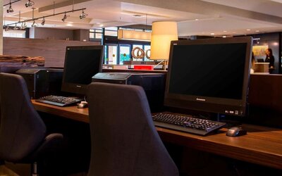 Business center with computers, printer and ergonomic chairs at Sonesta Select Atlanta Norcross I-85.