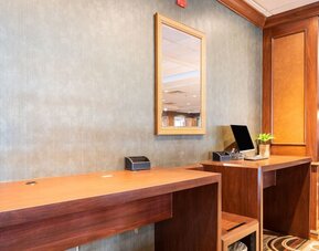 Lobby workspace with computer and printer at Wyndham Omaha. 