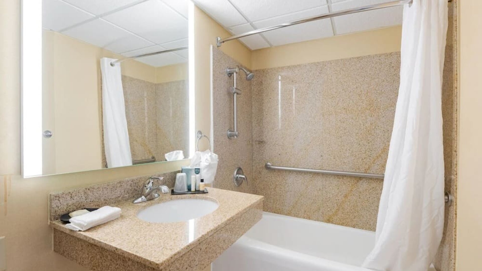 Private guest bathroom with free toiletries at Wyndham Omaha.
