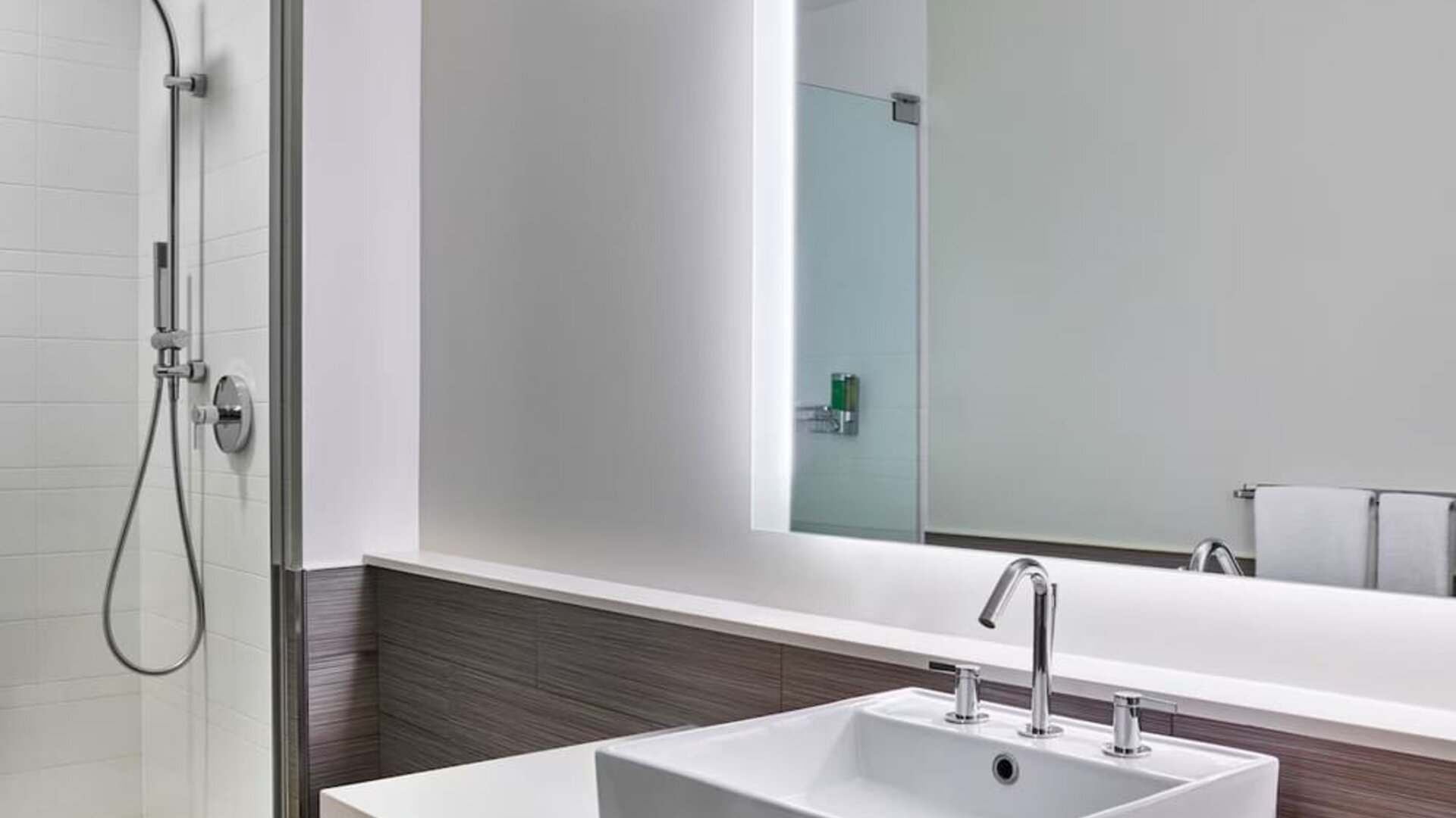 Private guest bathroom with shower at Element Miami International Airport.