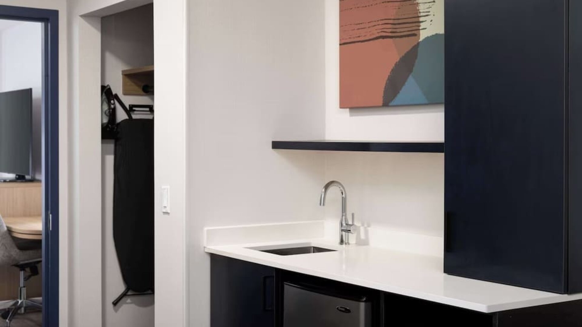 Kitchen and mini-fridge at Spark By Hilton Guelph.