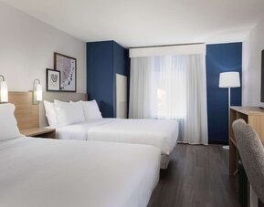 Day use room with queen beds and tv at Spark By Hilton Guelph.