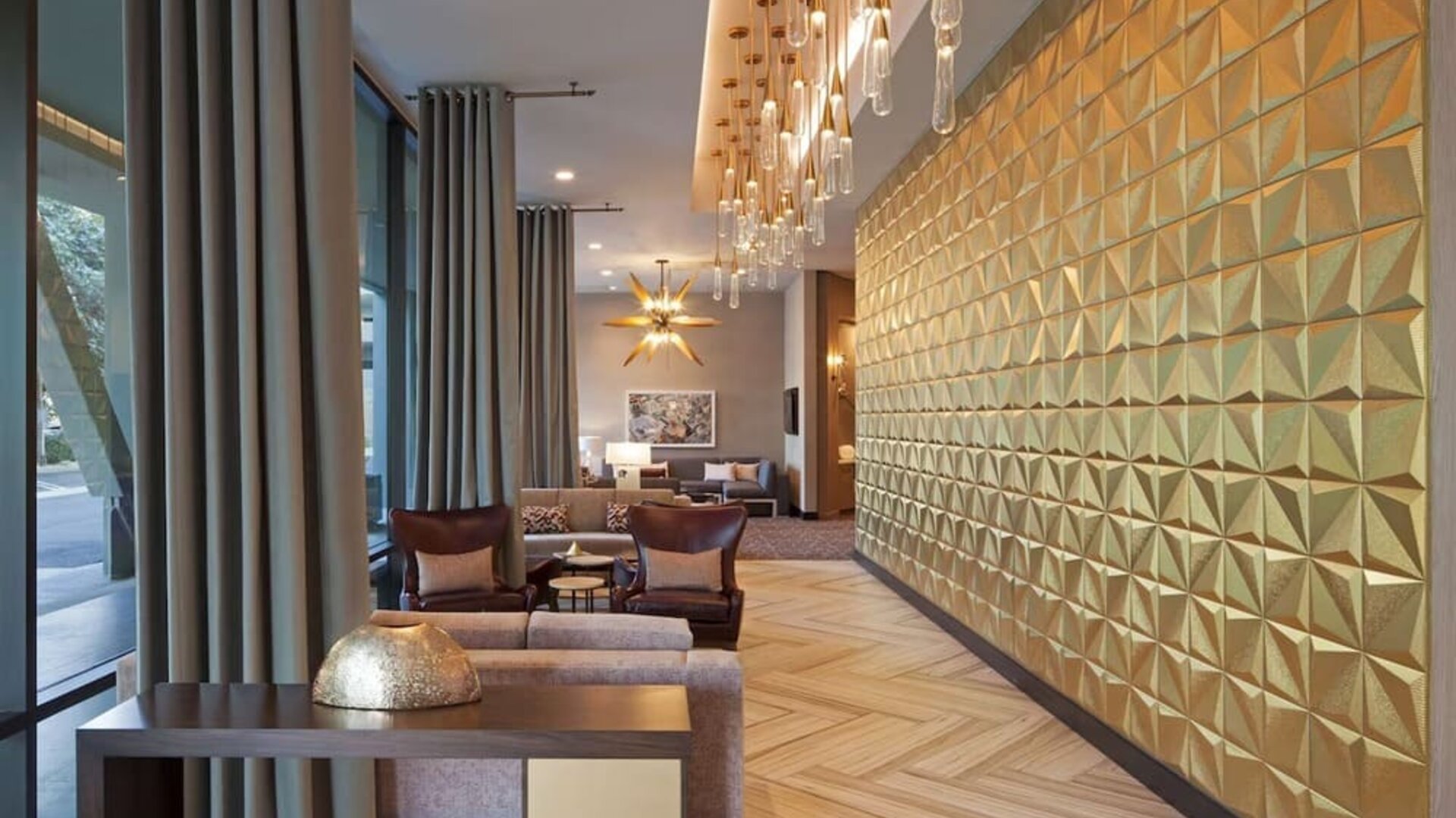 Lobby and coworking lounge at Homewood Suites By Hilton LAX Airport.