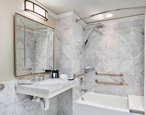 Private guest bathroom with shower and tub at The Westin Philadelphia.