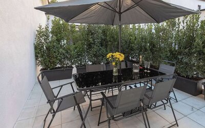 Outdoor terrace at Aiello Hotels - CityLife Apartments.
