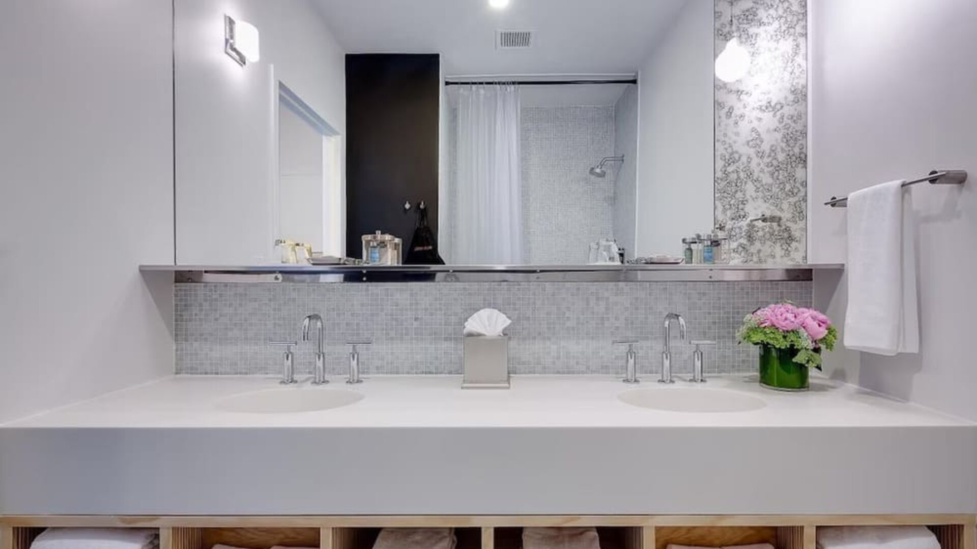 Private guest bathroom with shower and free toiletries at Nu Hotel - Brooklyn.