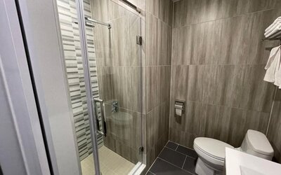 Private bathroom with shower at King Hotel Brooklyn.