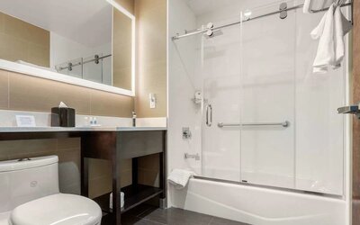 Private guest bathroom with free toiletries at Comfort Inn Prospect Park-Brooklyn.