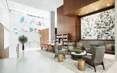 Lobby workspace and lounge area at AC Hotel New York Times Square.