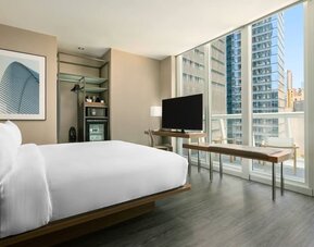 Day use room with work desk, balcony and private bathroom at AC Hotel New York Times Square.