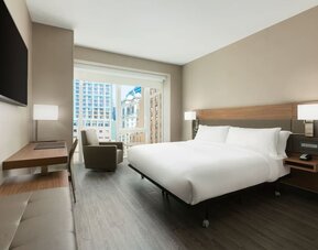 Day use room with workspace, large windows and private bathroom at AC Hotel New York Times Square.