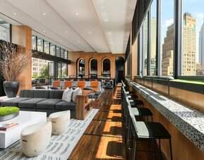 Lounge area with comfortable seating, perfect for coworking at AC Hotel New York Times Square.
