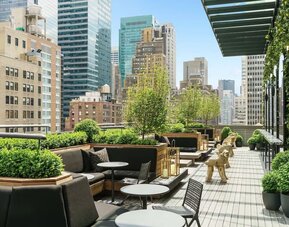 Beautiful terrace with comfortable seating at AC Hotel New York Times Square.