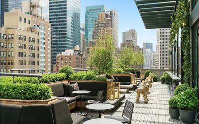 Beautiful terrace with comfortable seating at AC Hotel New York Times Square.
