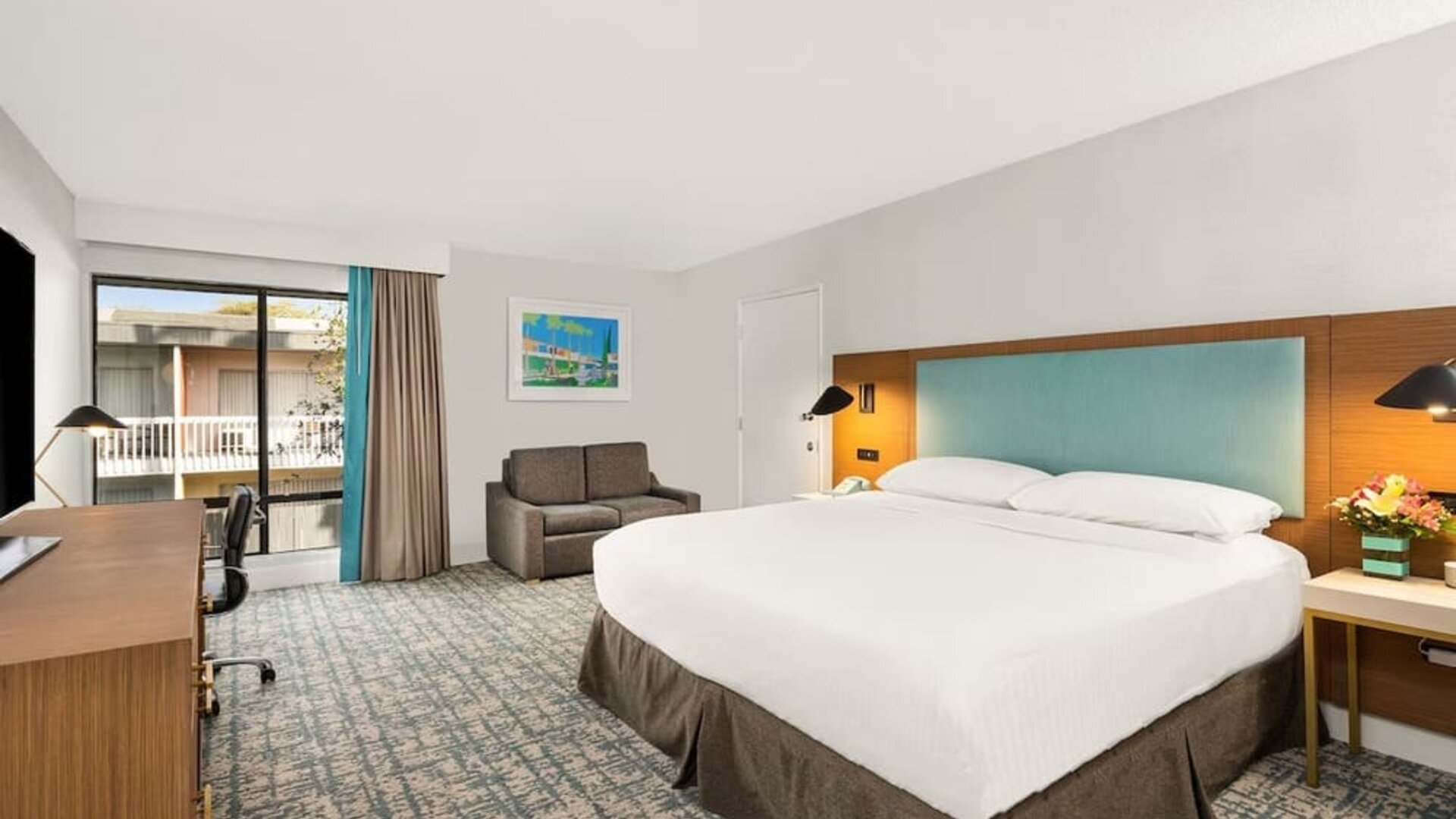 Day use room with work desk and natural light at The Anaheim Hotel.